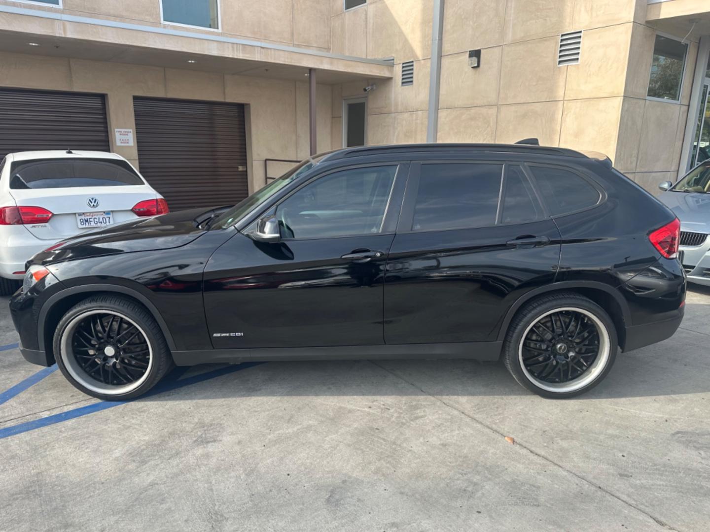 2014 Black /Black BMW X1 (WBAVM1C57EV) with an 4 CYLINDER engine, Automatic transmission, located at 30 S. Berkeley Avenue, Pasadena, CA, 91107, (626) 248-7567, 34.145447, -118.109398 - Photo#2